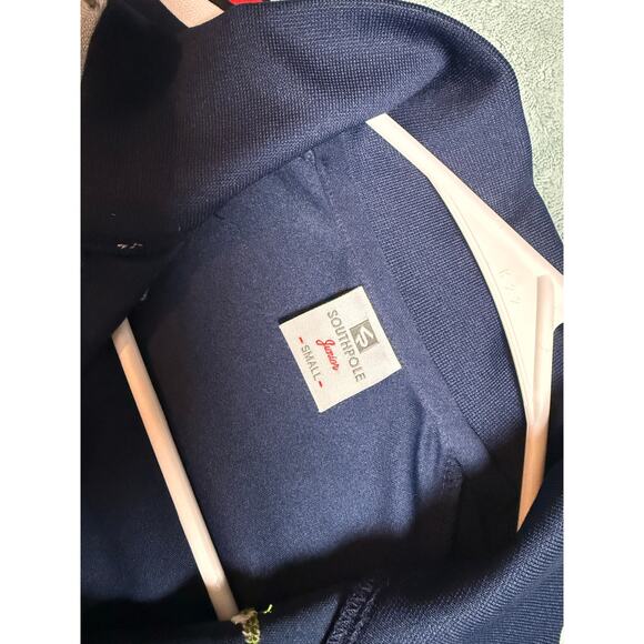 Navy blue floral zip up track jacket with red and white striped sleeves - Picture 7 of 8